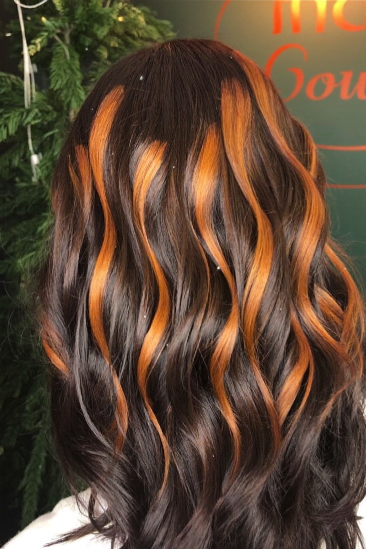 Caramel balayage on long dark hair
